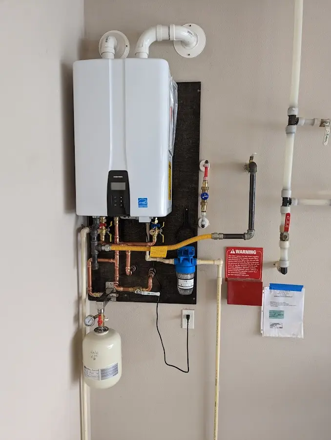 Professional plumber installing copper piping in a Lawndale home